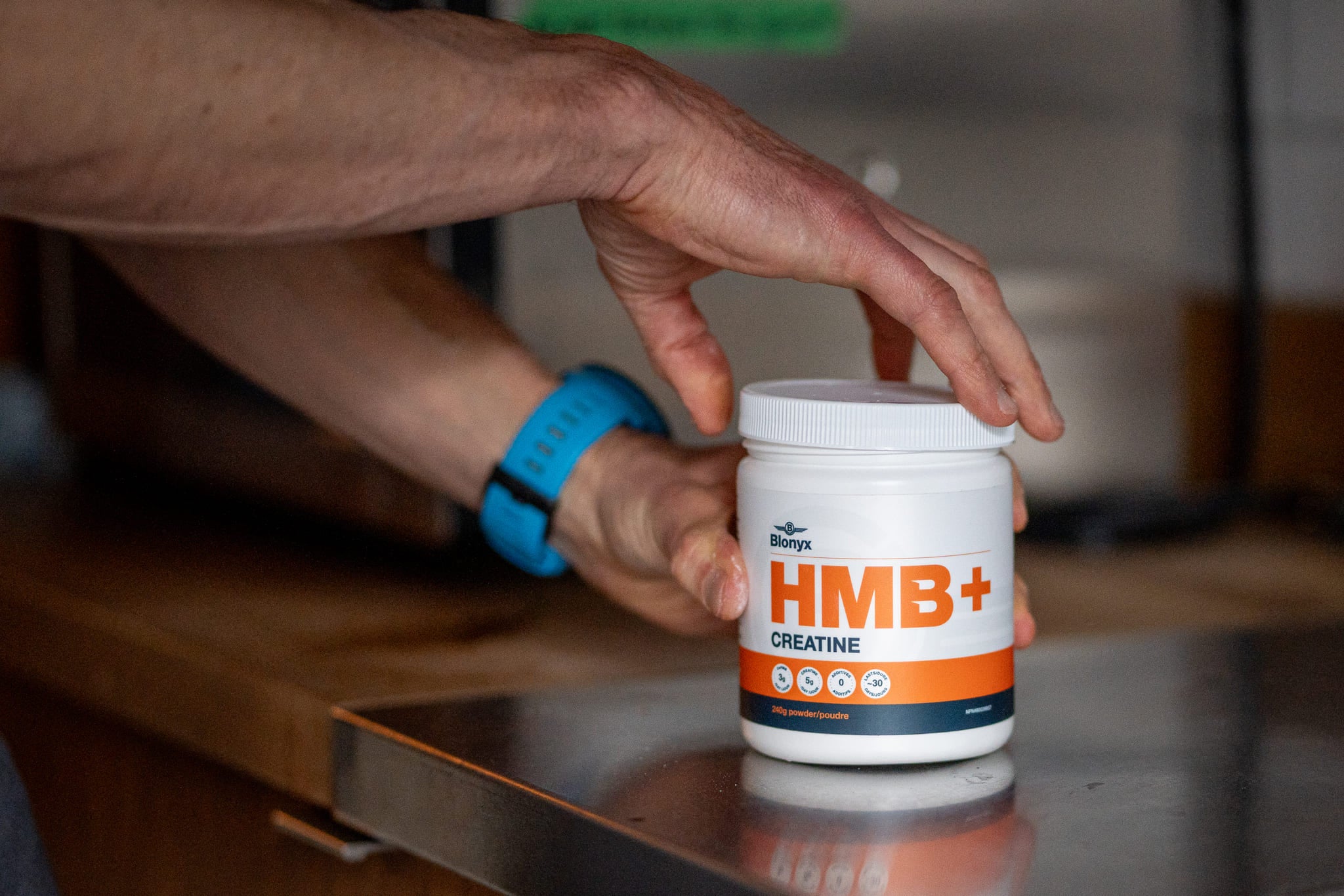 Opening a Container of HMB+ Creatine