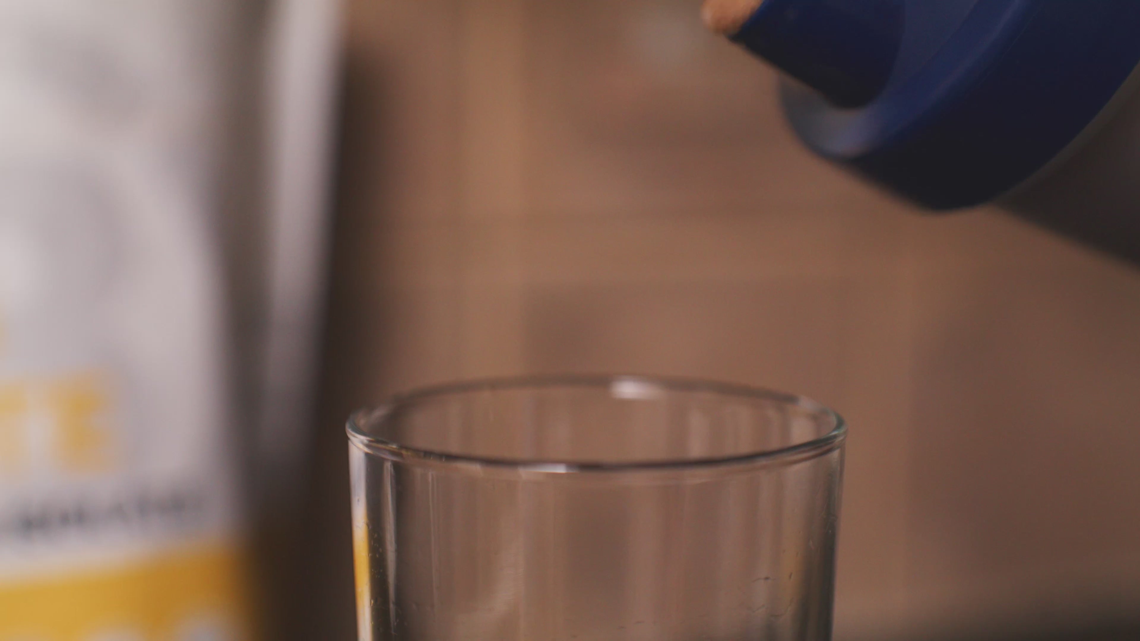 Pouring Blonyx Egg White Protein Isolate from a shaker cup into a glass