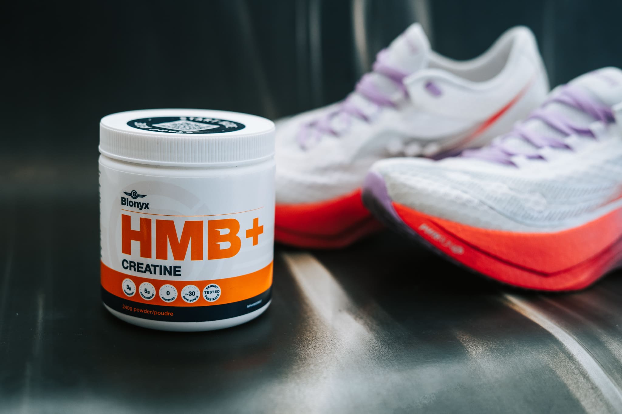Blonyx HMB+ Creatine and a pair of running shoes