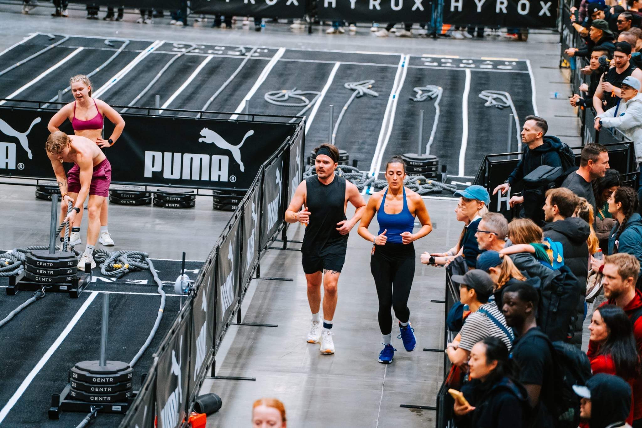 HYROX doubles partners running between stations
