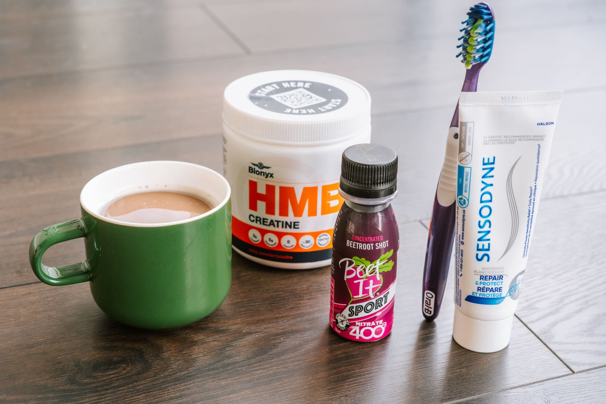Coffee, Blonyx HMB+ Creatine, Beet It Sport Nitrate 400, and a Toothbrush and Toothpaste
