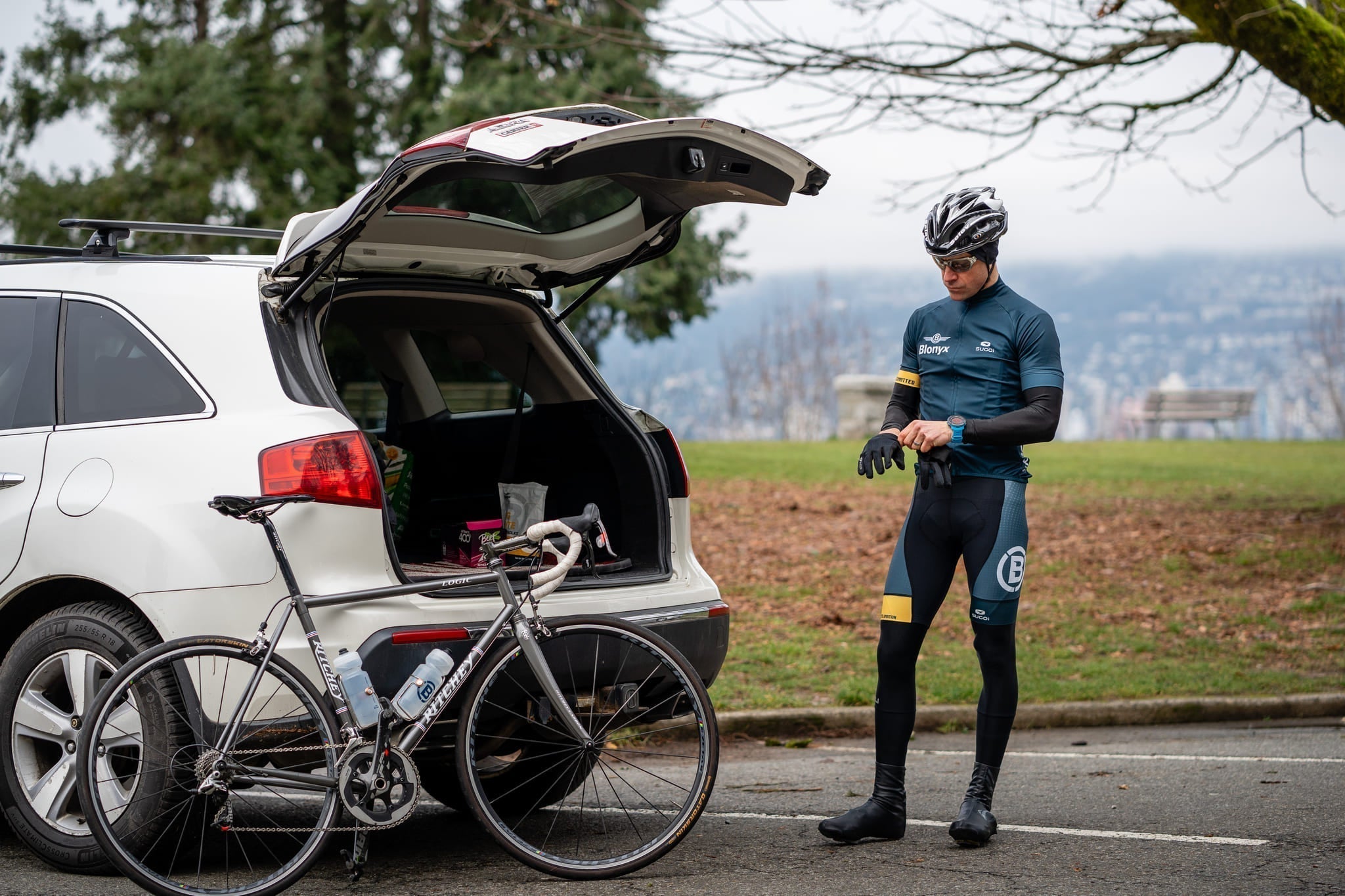cycling athlete putting gloves on before a winter ride