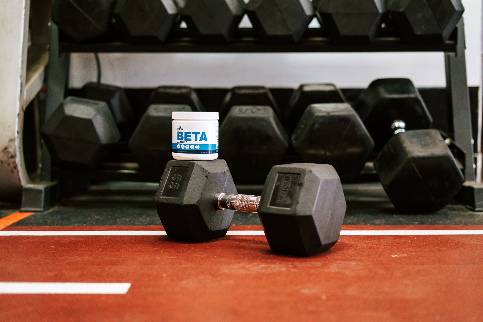 Blonyx Beta Alnanine on a Dumbbell in a Gym