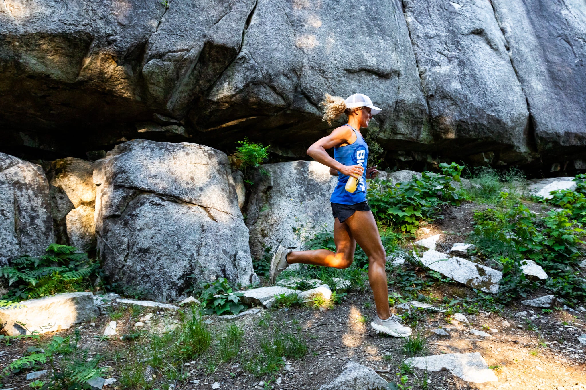 A Blonyx Athlete on a Trail Run with a Bottle of Hydra+