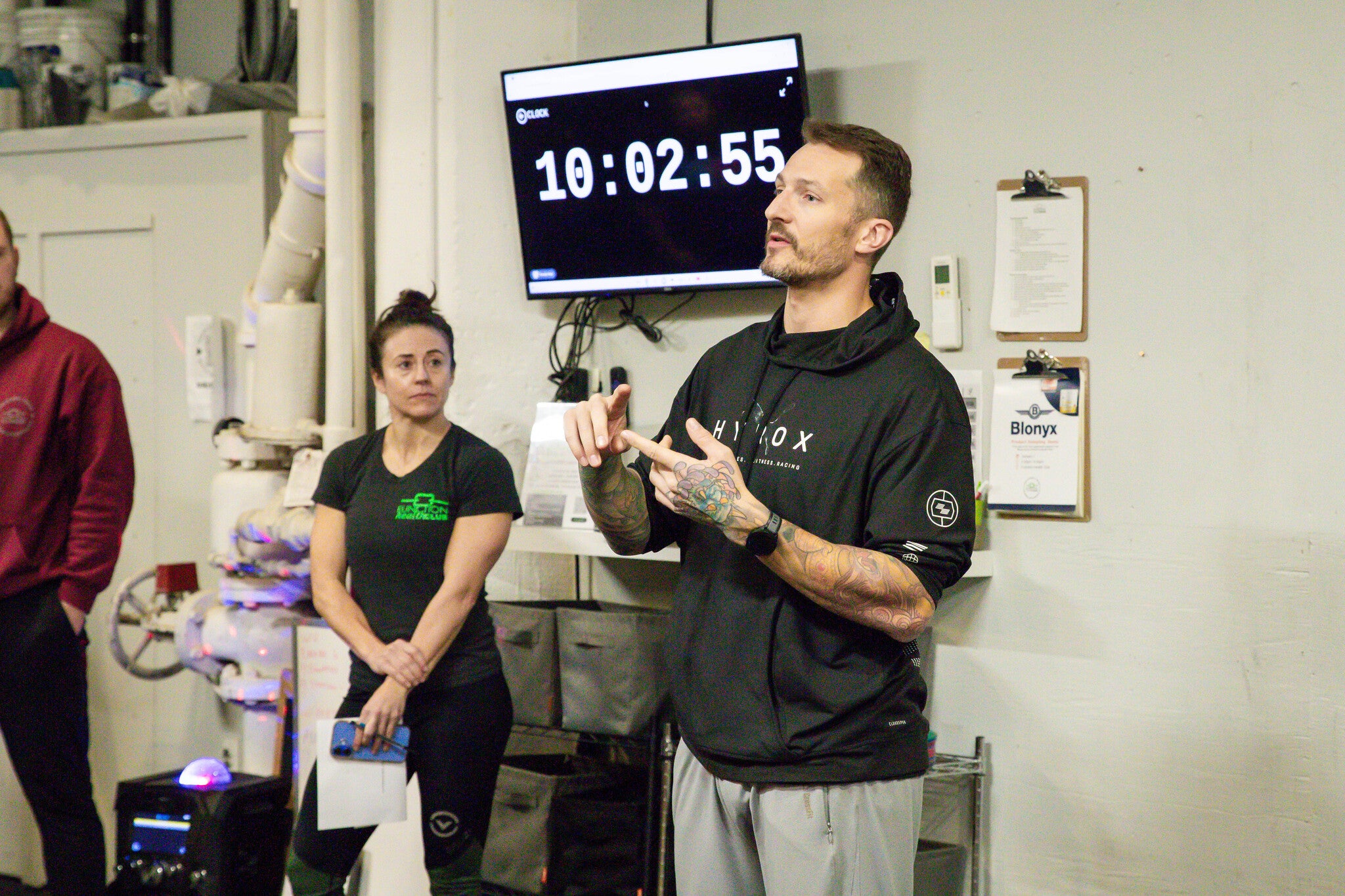 Coach Kyle Vis teaching a lesson on HYROX PFT